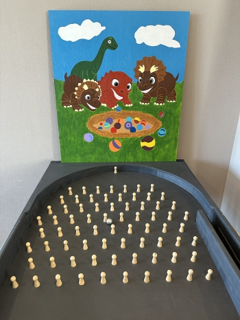 Knikkerspel dinosaurus